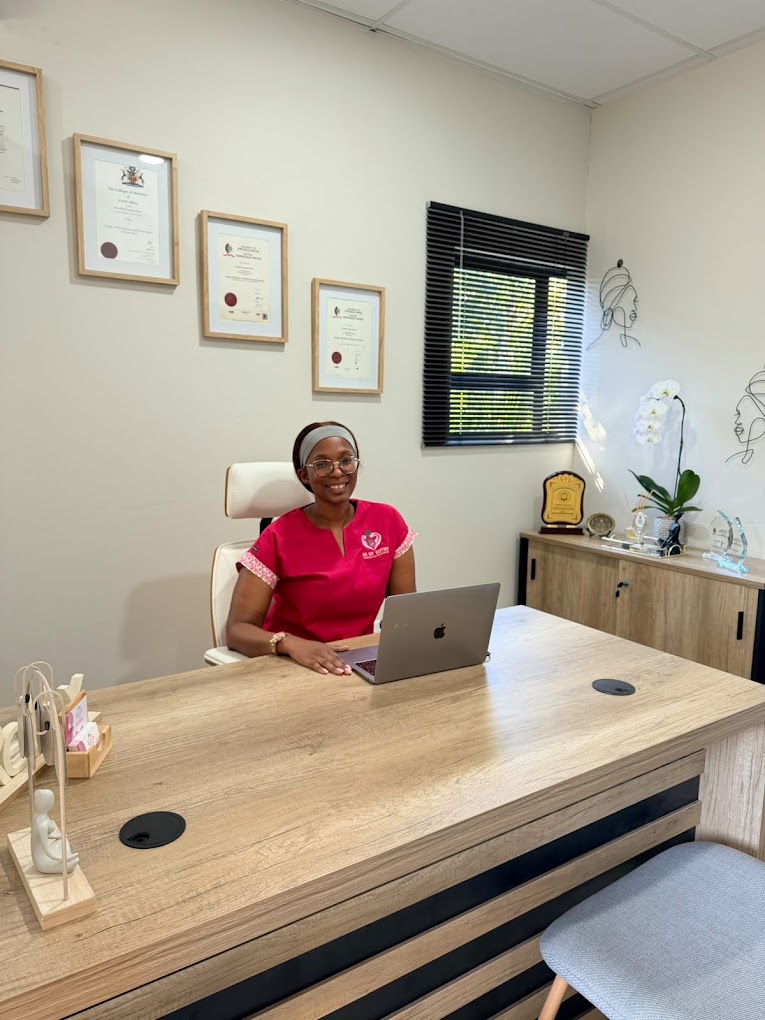 Dr Nonelwa Tamara Sotsu seated at her desk in the consulting room
